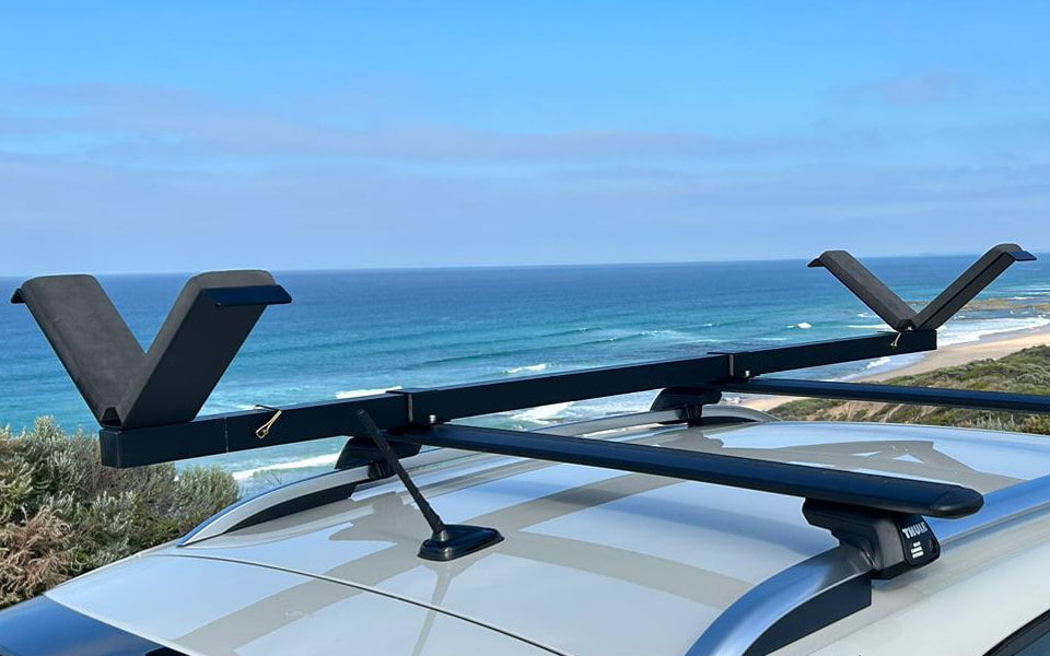 Vrack Removable Wings Set Installed on Roof with Beach background